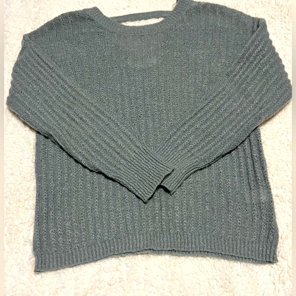 Plain grey sweater. Good conditions. Size is small